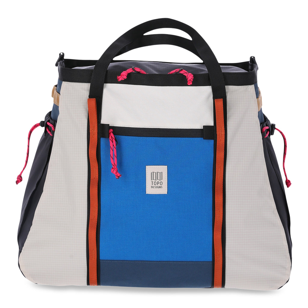 Topo Designs Mountain Gear Bag in Bone White / Black shown on white background. Bag features black nylon webbing handles and colorblocked nylon panels. Item is shown on white background. 
