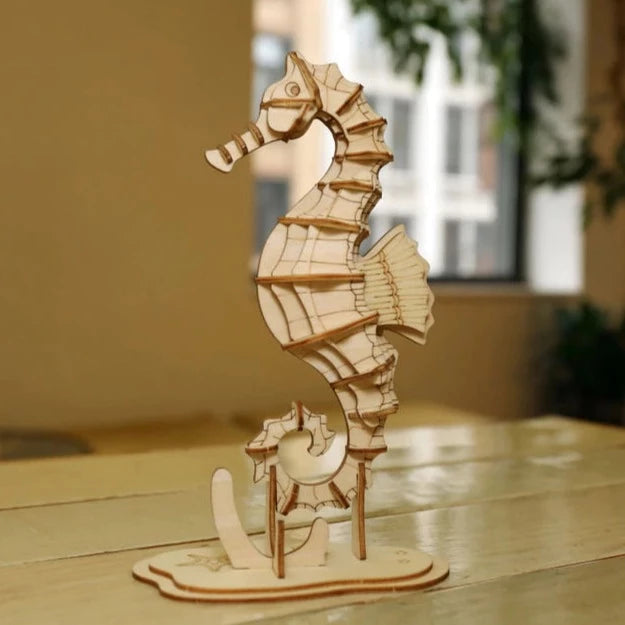 3D Puzzle in the shape of a seahorse. Flat packed wooden punch-out pieces. Ages 3+, but grown-up help might be needed for children younger than 10. Perfect scale to take on a trip or give as a gift!